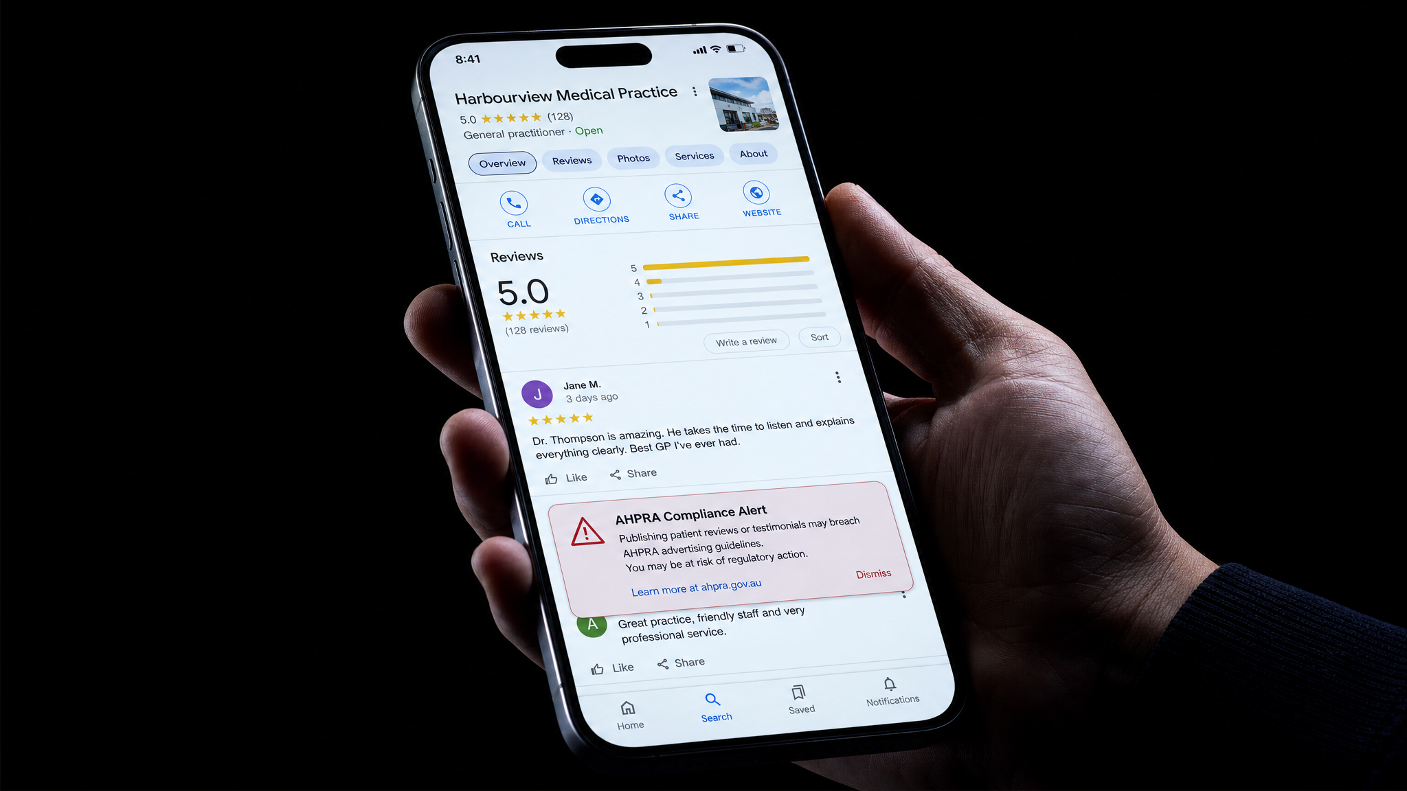 Smartphone displaying Google Business listing with five star review ratings for a medical practice with AHPRA compliance warning alert overlay representing testimonial regulation risk